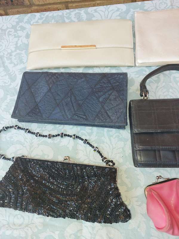 A COLLECTION OF CLUTCH BAGS SOLD AS IS