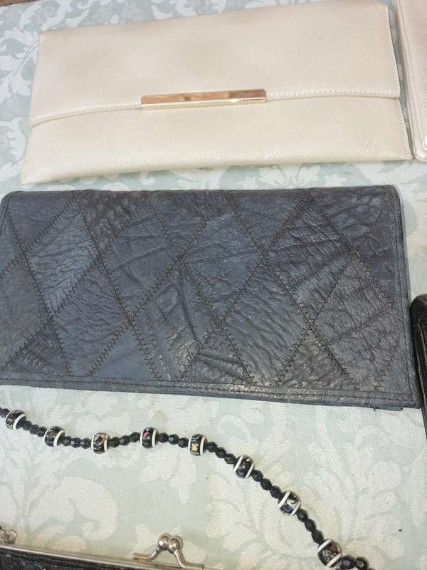 A COLLECTION OF CLUTCH BAGS SOLD AS IS