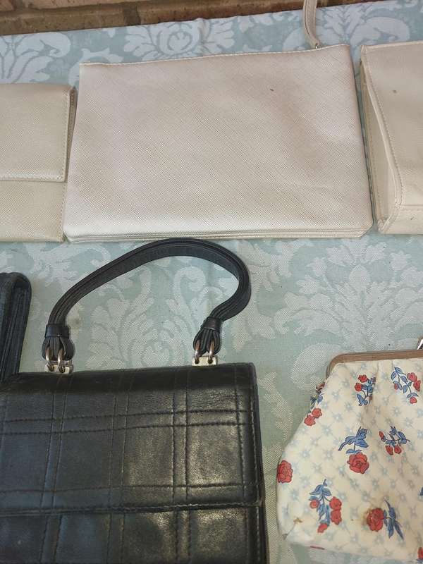 A COLLECTION OF CLUTCH BAGS SOLD AS IS