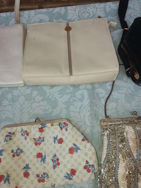 A COLLECTION OF CLUTCH BAGS SOLD AS IS