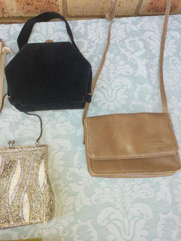 A COLLECTION OF CLUTCH BAGS SOLD AS IS