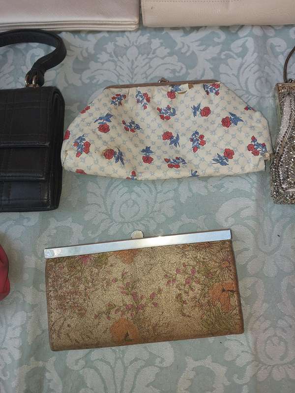 A COLLECTION OF CLUTCH BAGS SOLD AS IS