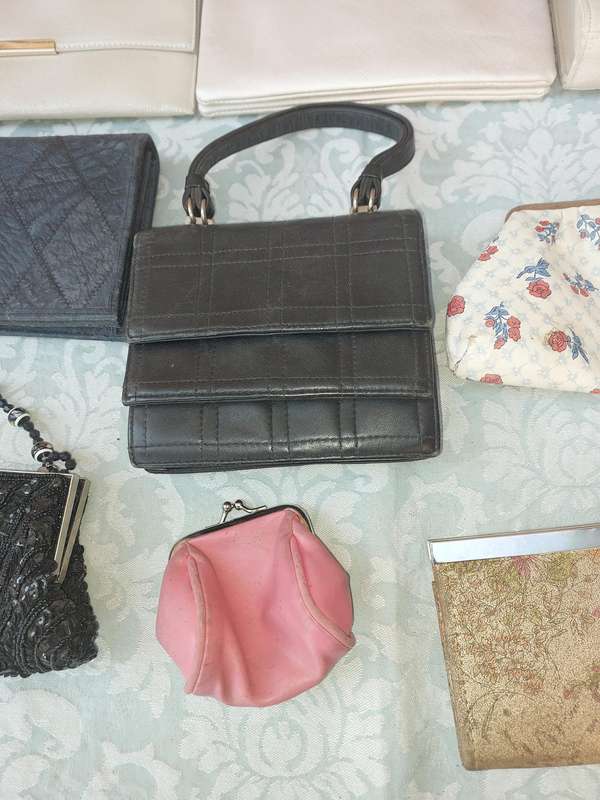 A COLLECTION OF CLUTCH BAGS SOLD AS IS