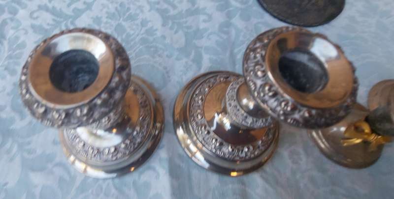 A VINTAGE JOBLOT SILVER PLATED CANDLE STANDS AND HOLDERS SOLD AS IS