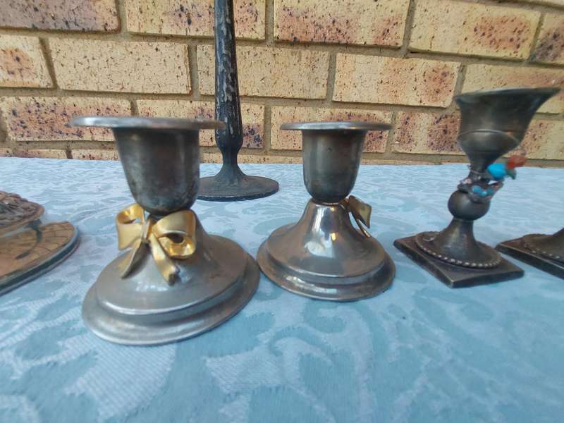 A VINTAGE JOBLOT SILVER PLATED CANDLE STANDS AND HOLDERS SOLD AS IS