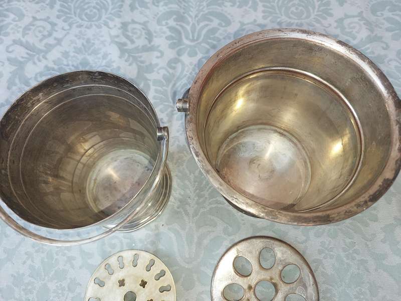 A COLLECTION OF VINTAGE SILVER PLATED ICE BUCKETS SOLD AS IS