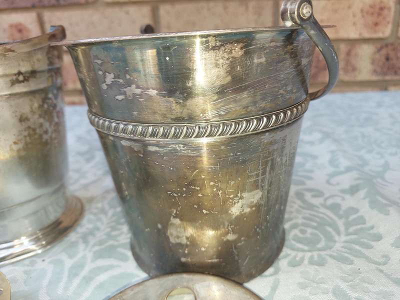 A COLLECTION OF VINTAGE SILVER PLATED ICE BUCKETS SOLD AS IS