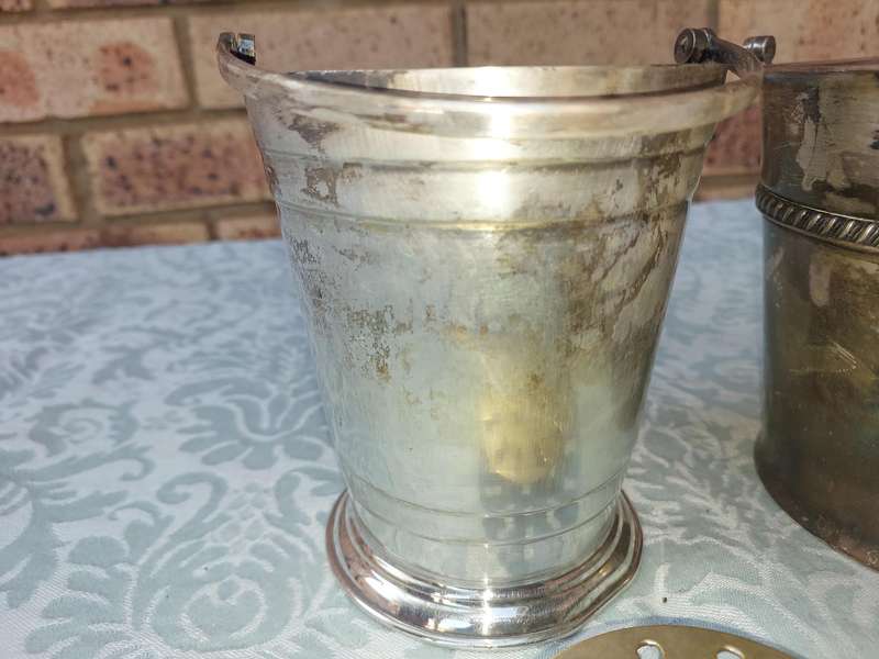 A COLLECTION OF VINTAGE SILVER PLATED ICE BUCKETS SOLD AS IS