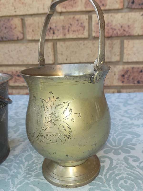 A COLLECTION OF VINTAGE SILVER PLATED ICE BUCKETS SOLD AS IS