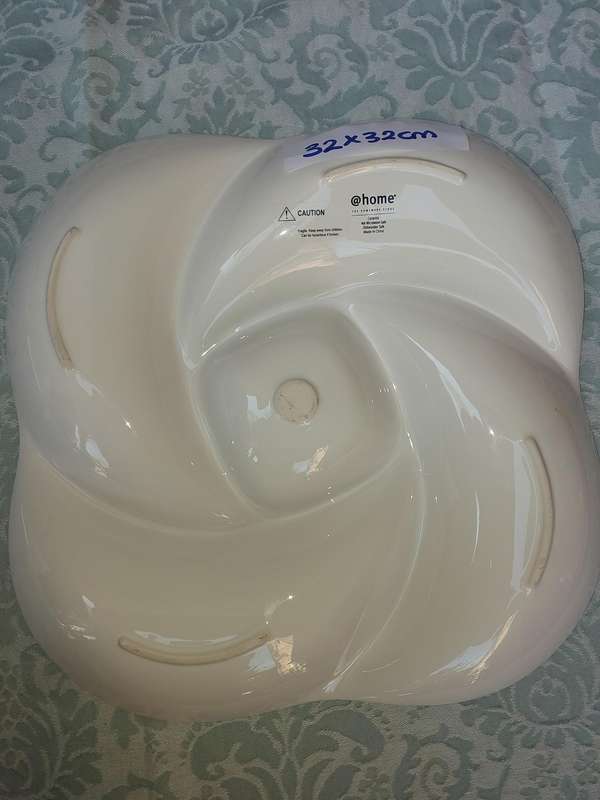 A COLLECTION OF WHITE PORCELAIN PLATTERS SOLD AS IS