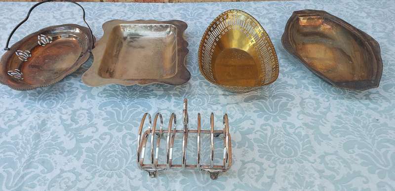 AN ENTIRE COLLECTION OF EPNS WEDDING SERVING BASKETS AND KITCHEN UNTENSILS SOLD AS IS