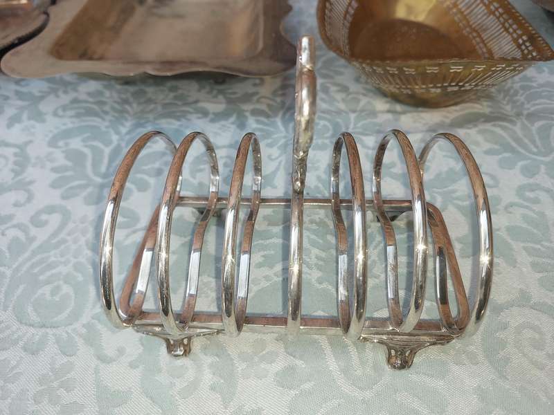 AN ENTIRE COLLECTION OF EPNS WEDDING SERVING BASKETS AND KITCHEN UNTENSILS SOLD AS IS
