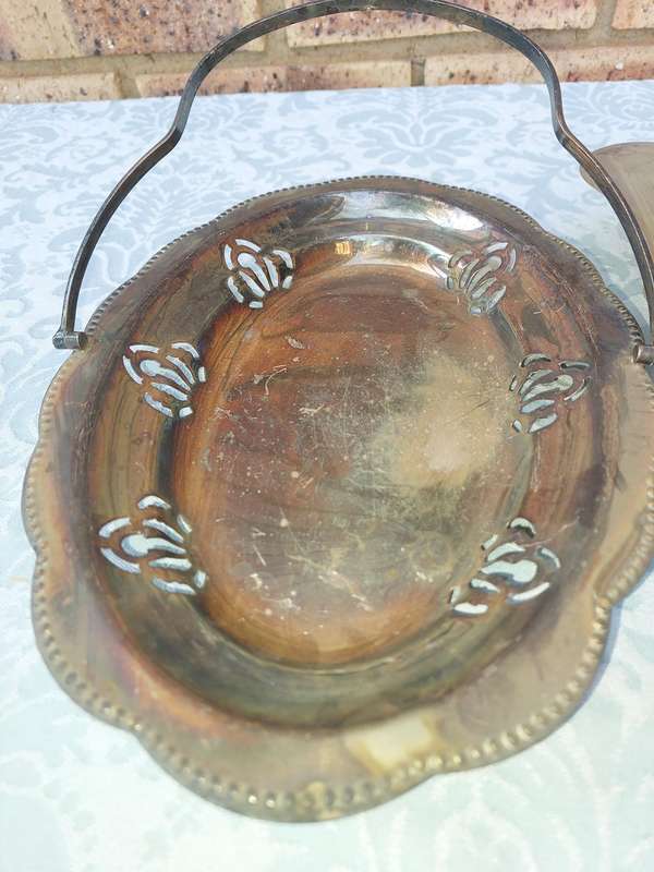 AN ENTIRE COLLECTION OF EPNS WEDDING SERVING BASKETS AND KITCHEN UNTENSILS SOLD AS IS