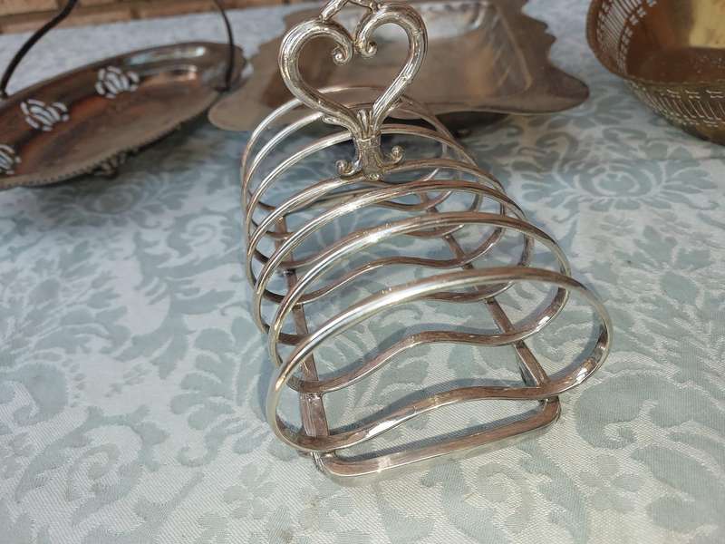 AN ENTIRE COLLECTION OF EPNS WEDDING SERVING BASKETS AND KITCHEN UNTENSILS SOLD AS IS