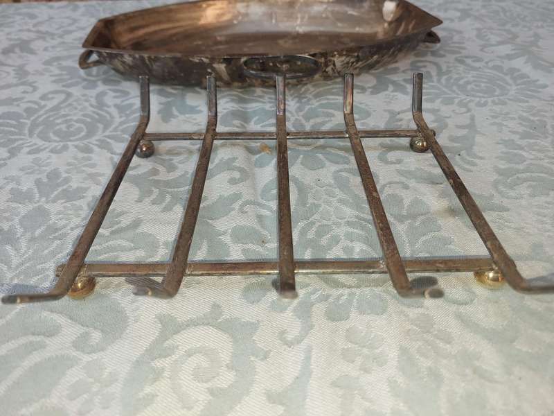 A VINTAGE SILVER PLATED SERVING PLATTER ON A SERVING STAND SOLD AS IS