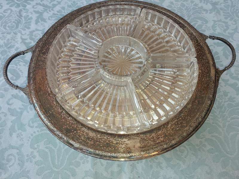 A VINTAGE LAZY SUZAN WITH A SILVER PLATED TRAY , THE HANDLE NEEDS REPAIRS SOLD AS IS