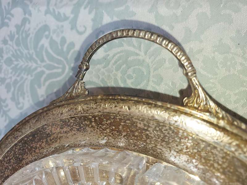 A VINTAGE LAZY SUZAN WITH A SILVER PLATED TRAY , THE HANDLE NEEDS REPAIRS SOLD AS IS