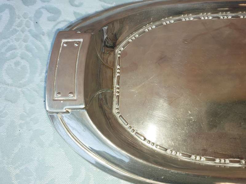 A SILVER PLATED RECTANGULAR SERVING PLATER SOLD AS IS