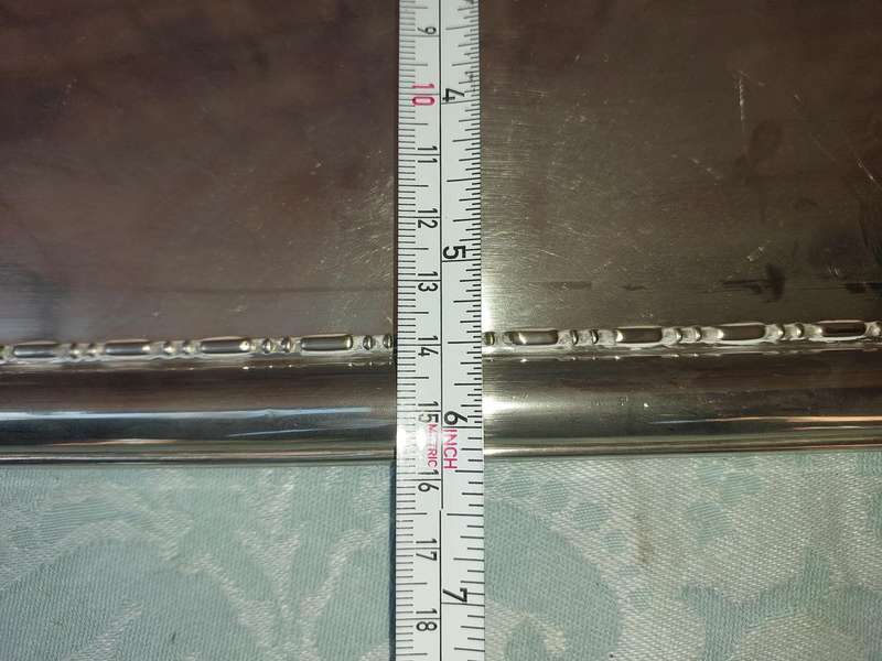 A SILVER PLATED RECTANGULAR SERVING PLATER SOLD AS IS