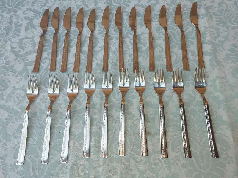 A SET OF 22 , 18/8 CUTLERY SOLD AS IS