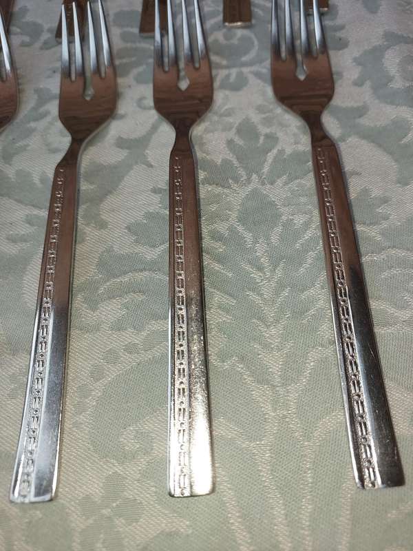 A SET OF 22 , 18/8 CUTLERY SOLD AS IS
