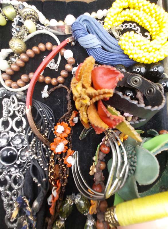 A collection of costume bangles and bracelets sold as is