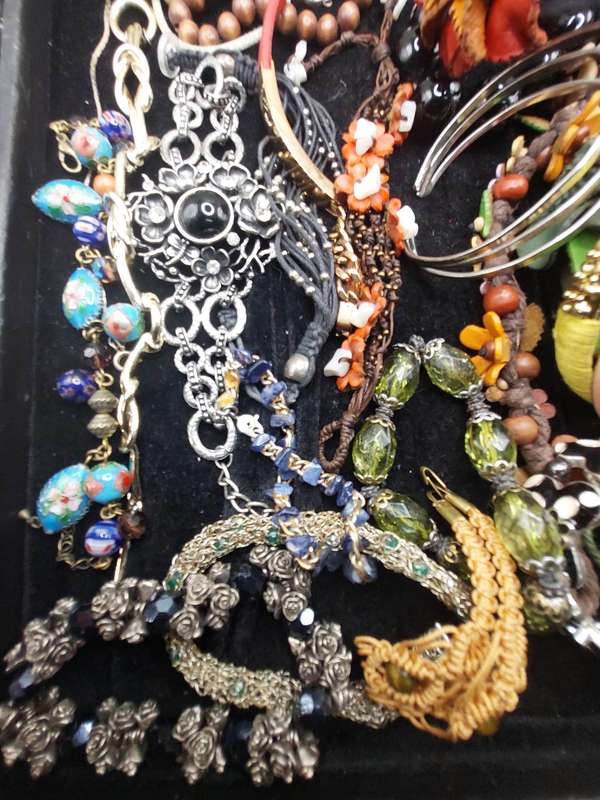 A collection of costume bangles and bracelets sold as is