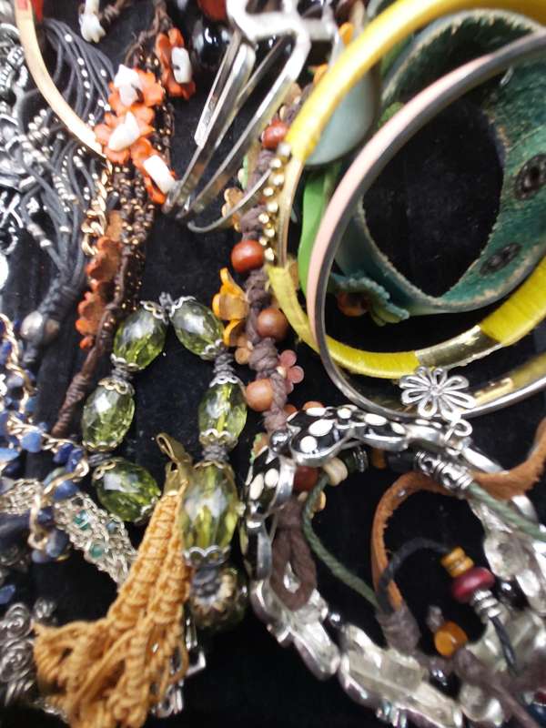 A collection of costume bangles and bracelets sold as is
