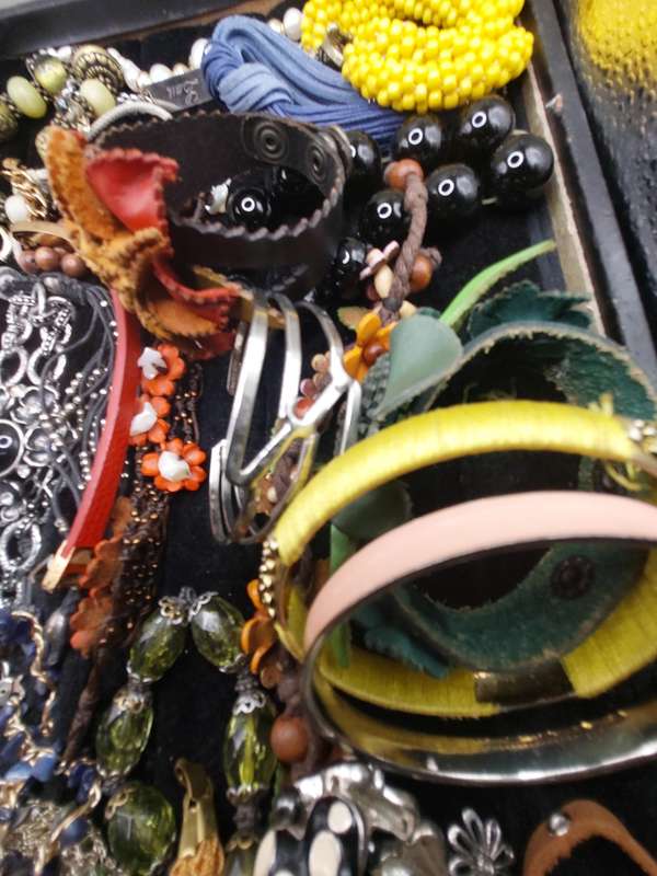 A collection of costume bangles and bracelets sold as is