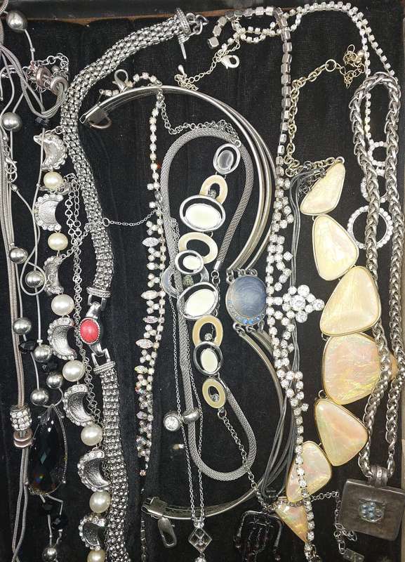 A QUALITY COLLECTION OF SILVER PLATED AND STAINLESS STEEL NECKLACES SOME WITH CRYSTALS SOLD AS IS