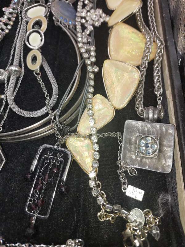 A QUALITY COLLECTION OF SILVER PLATED AND STAINLESS STEEL NECKLACES SOME WITH CRYSTALS SOLD AS IS