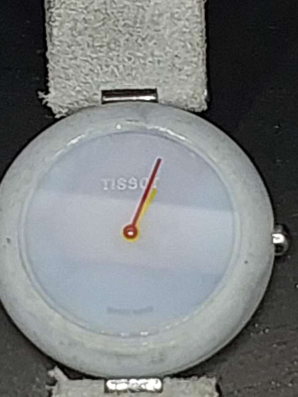 A RARE TISSOT GREY STONE WATCH