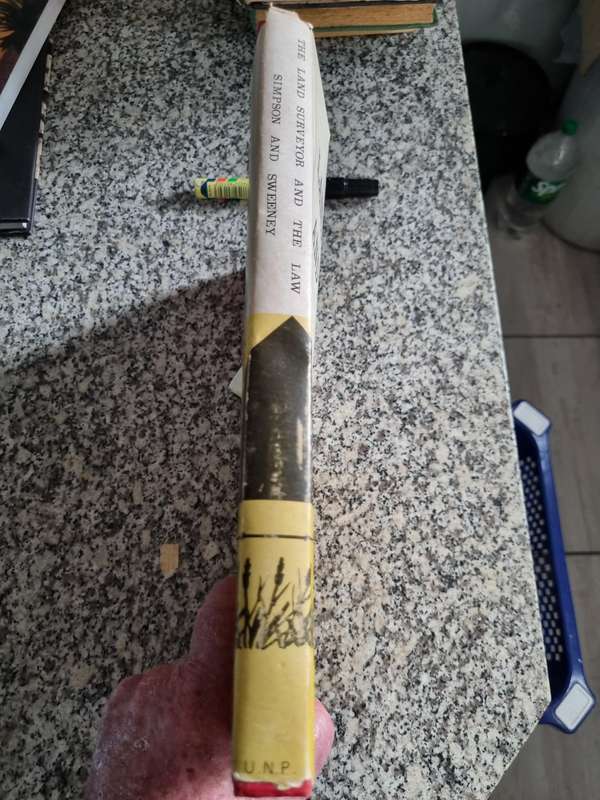 THE LAND SURVEYOR AND THE LAW SIMPSON and SWEENY 1973 ( Please note the condition of the cover )