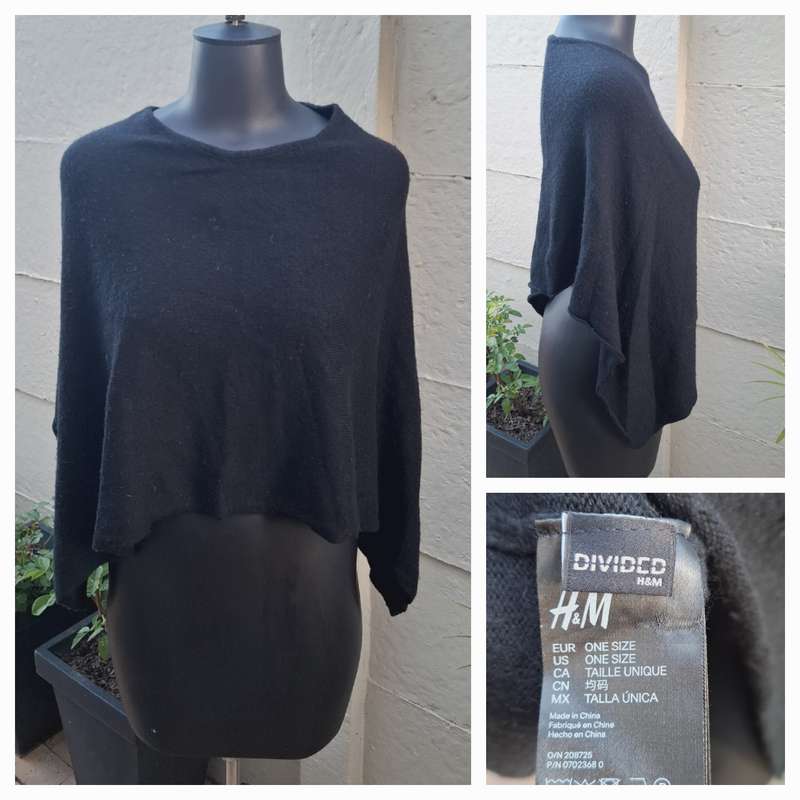 Black knit asymmetrical hemline knit poncho by Divided H&M. One size