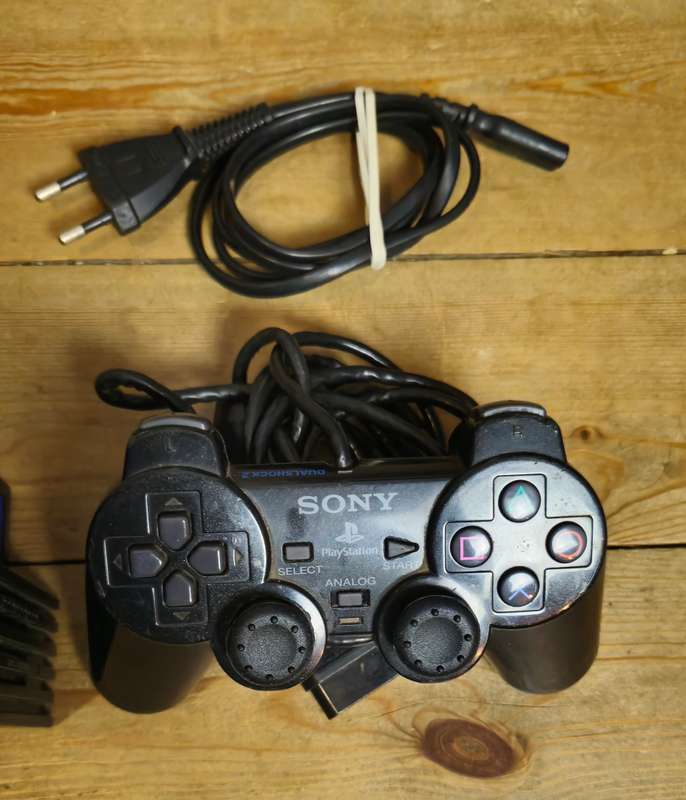 PlayStation 2 Console Bundle  Includes 4 Games, Memory Card & AV Cable