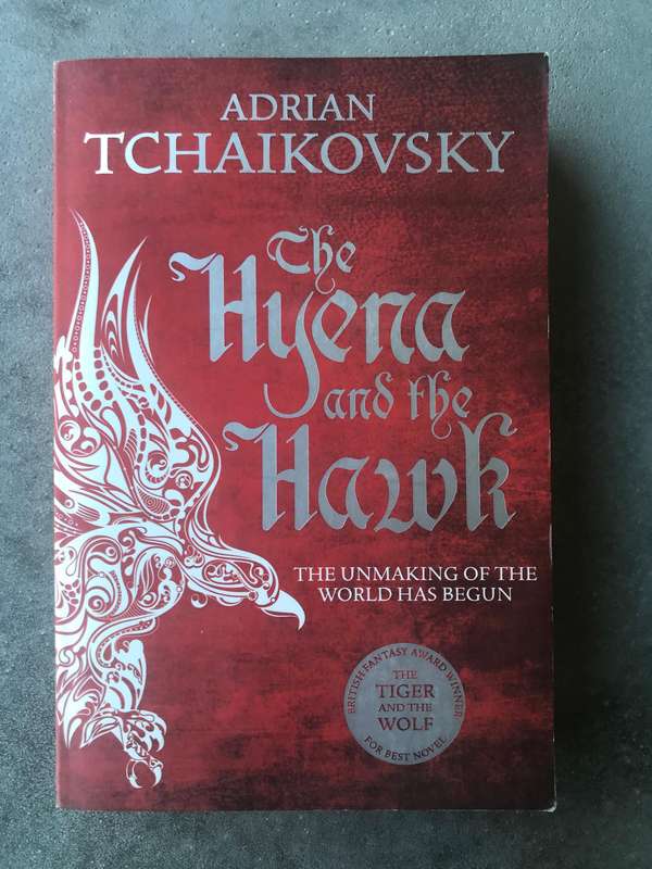 The Hyena and the Hawk (Echoes of the Fall #3) by Adrian Tchaikovsky [Paperback: Excellent]