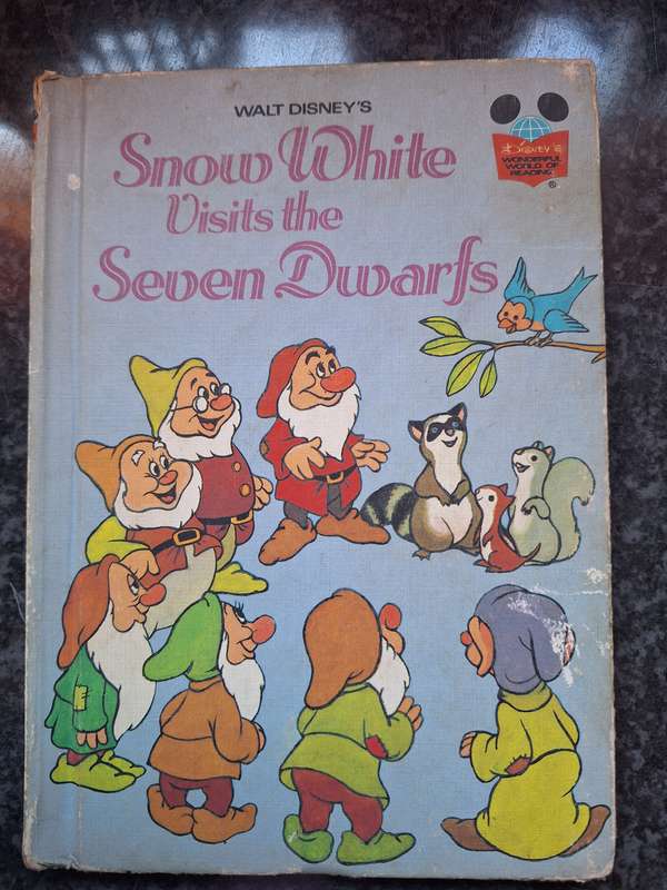 Snow White visits the Seven Dwarfs. DISNEY CHILDRENS BOOK