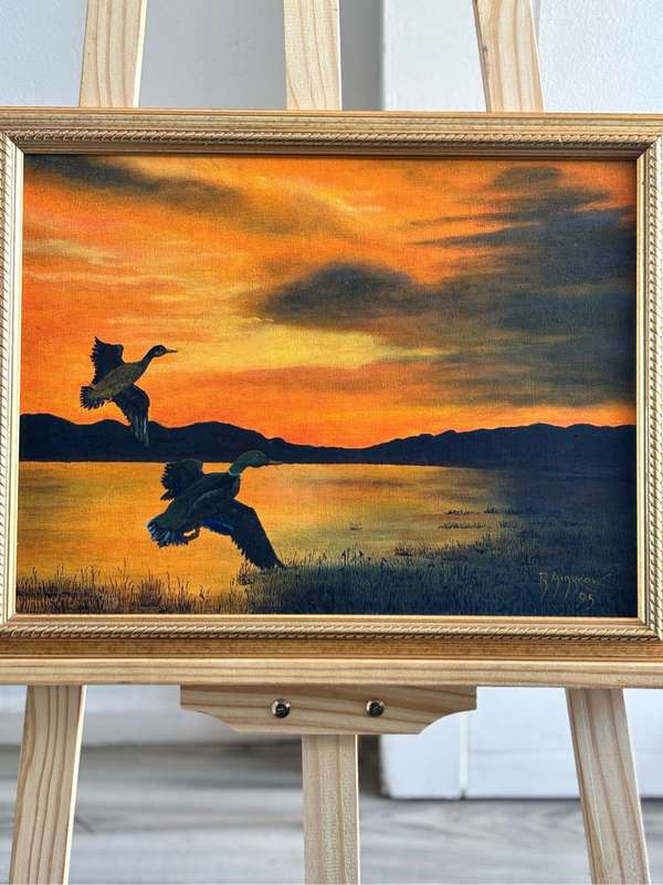 Painting by R Ainscow 1995 Two birds flying in sunset 36cm x 46cm with frame oil on board