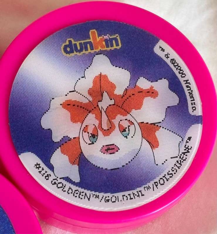 3x Pokémon 1997-2000 Nintendo Dunkin Morphing Tazos on pink containers