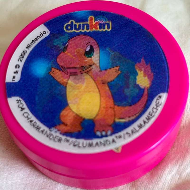 3x Pokémon 1997-2000 Nintendo Dunkin Morphing Tazos on pink containers
