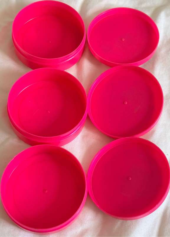 3x Pokémon 1997-2000 Nintendo Dunkin Morphing Tazos on pink containers