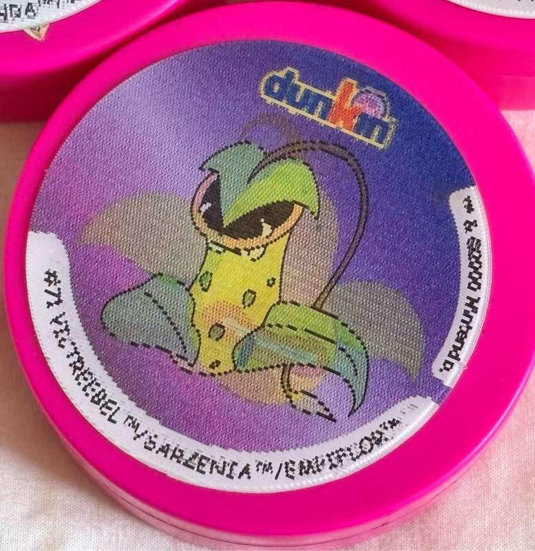 3x Pokémon 1997-2000 Nintendo Dunkin Morphing Tazos on pink containers