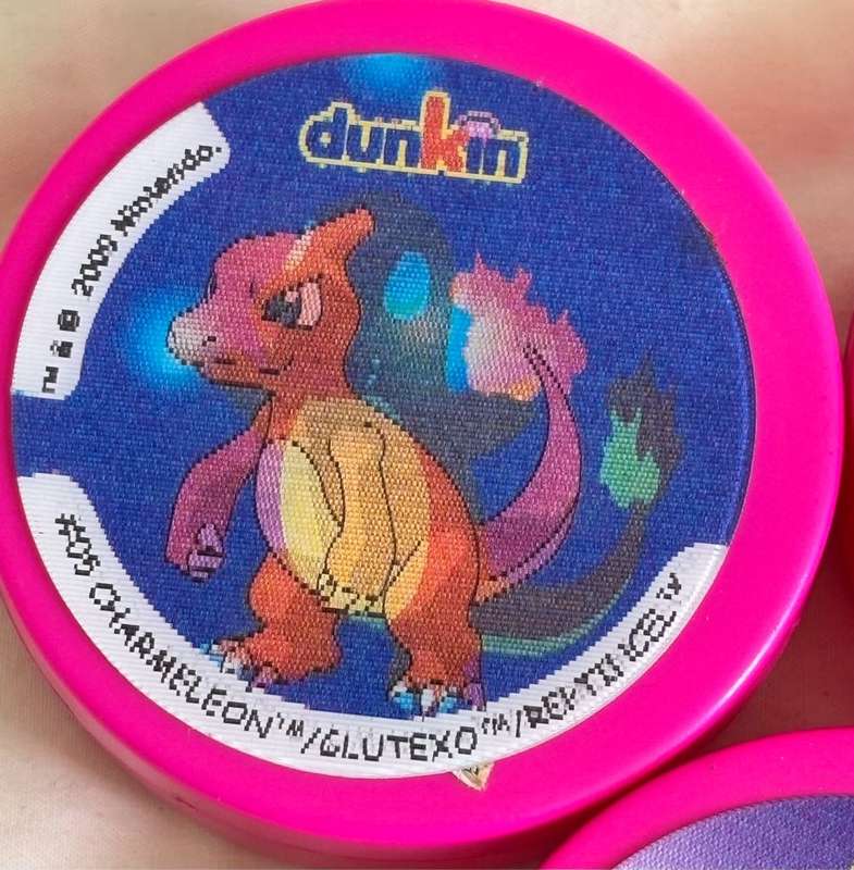 3x Pokémon 1997-2000 Nintendo Dunkin Morphing Tazos on pink containers