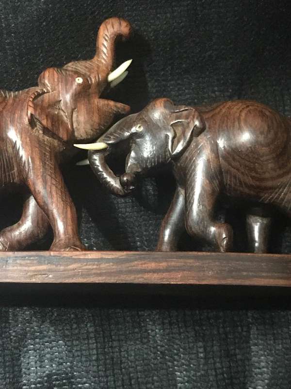 Hand carved wooden Elephants playful collectable