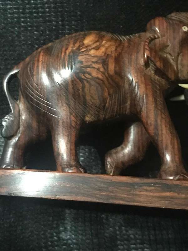 Hand carved wooden Elephants playful collectable