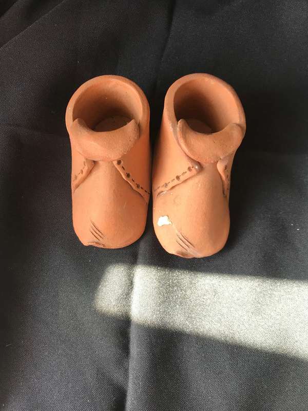 Clay pottery two shoes