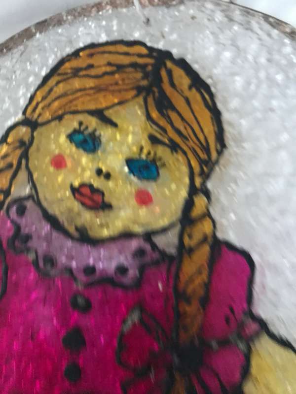 Vintage doll painted on plastic decor