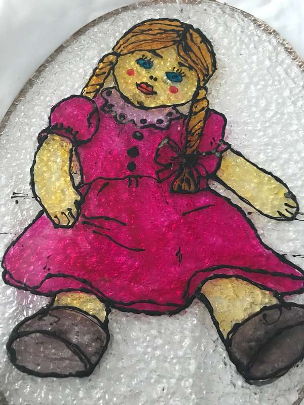 Vintage doll painted on plastic decor