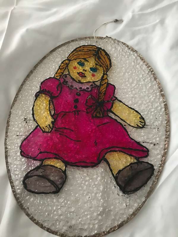 Vintage doll painted on plastic decor