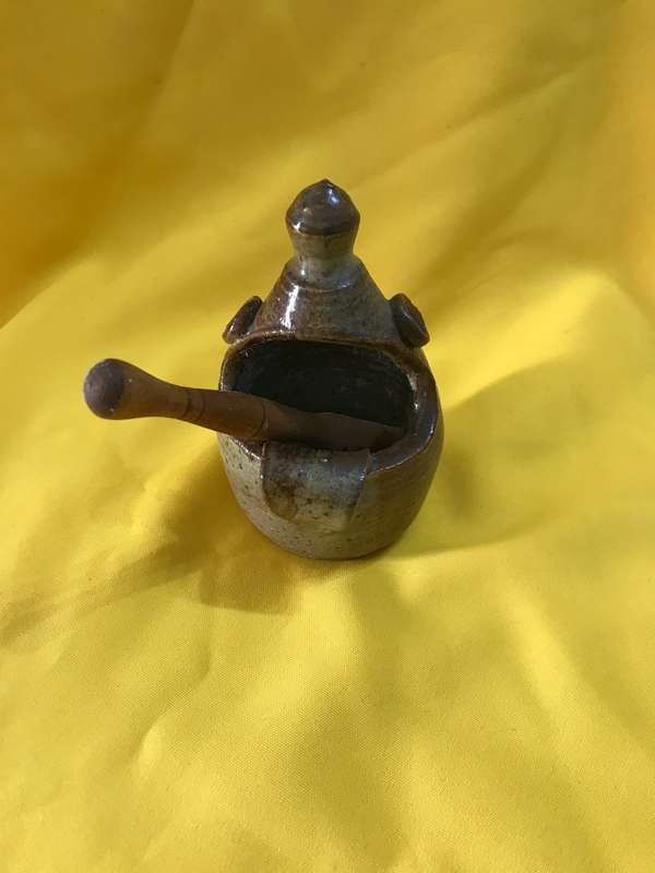Pottery bowl with wooden spoon